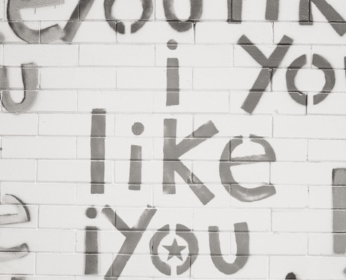 brick wall with the phrase i like you on it