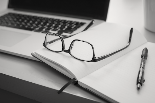 a notebook and laptop